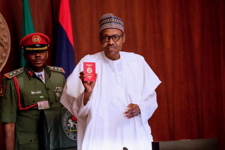 Nigeria Immigration Service (NIS) Present President Buhari Mohammed with a new 10- year Diplomatic E-Passport