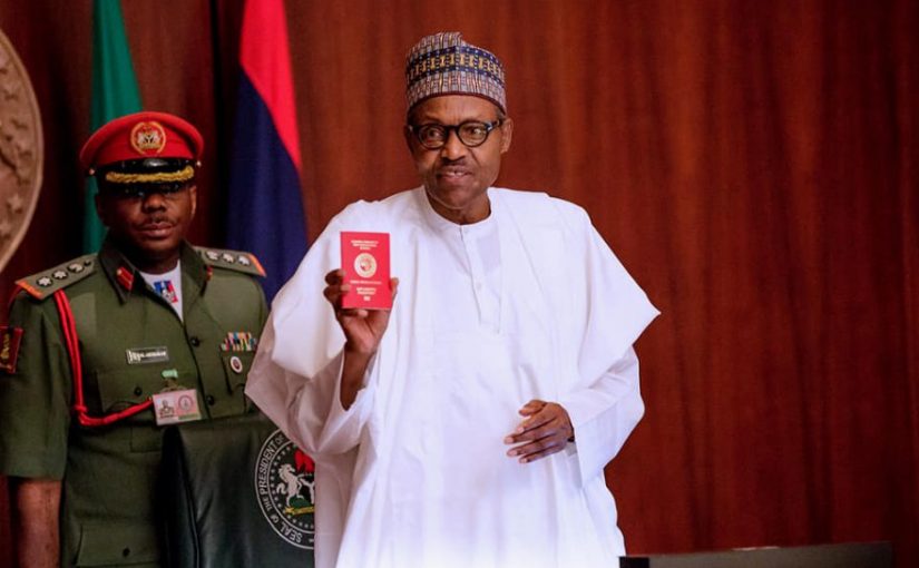 Nigeria Immigration Service (NIS) Present President Buhari Mohammed with a new 10- year Diplomatic E-Passport