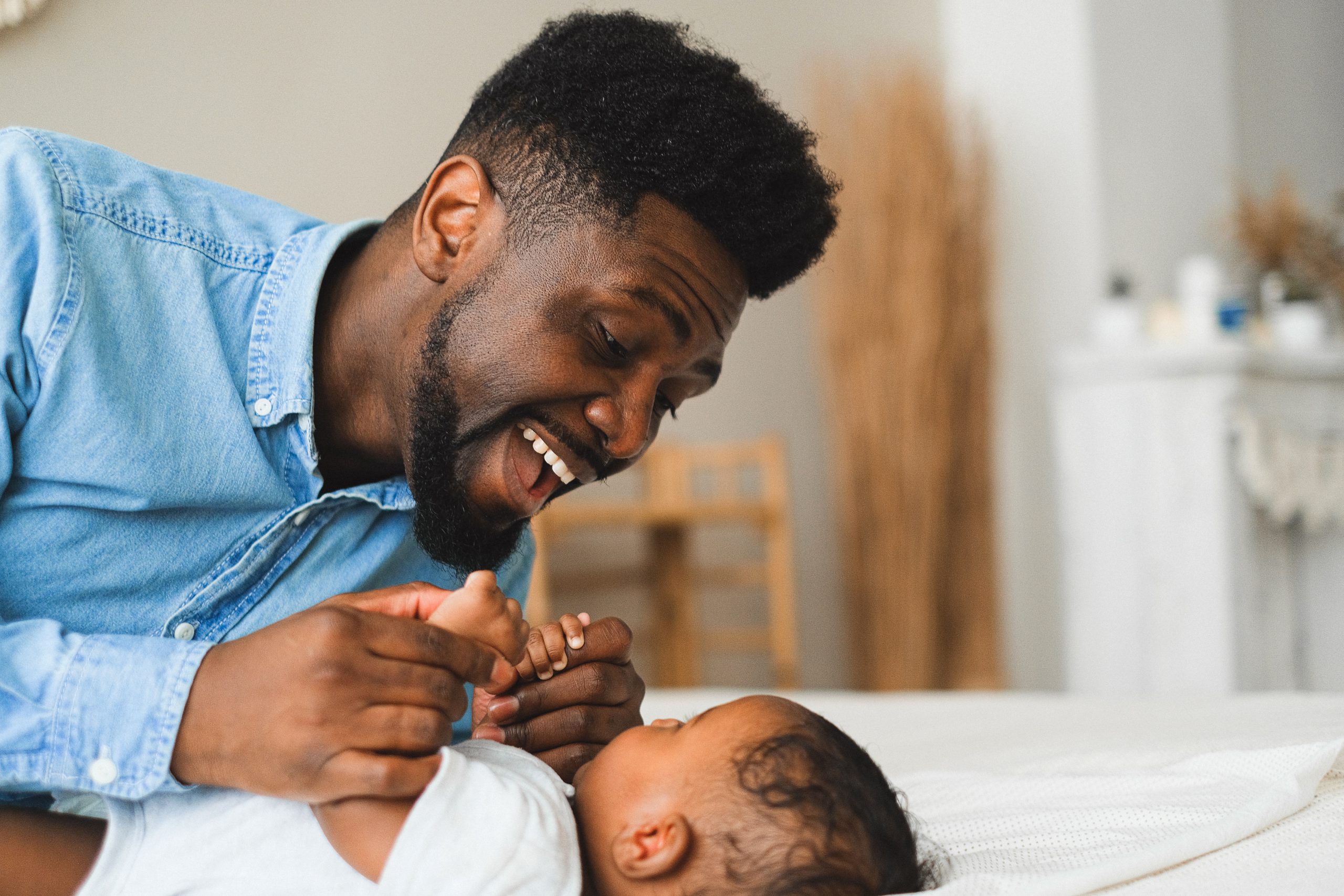 Father and baby Credit: pexels-anna-shvets