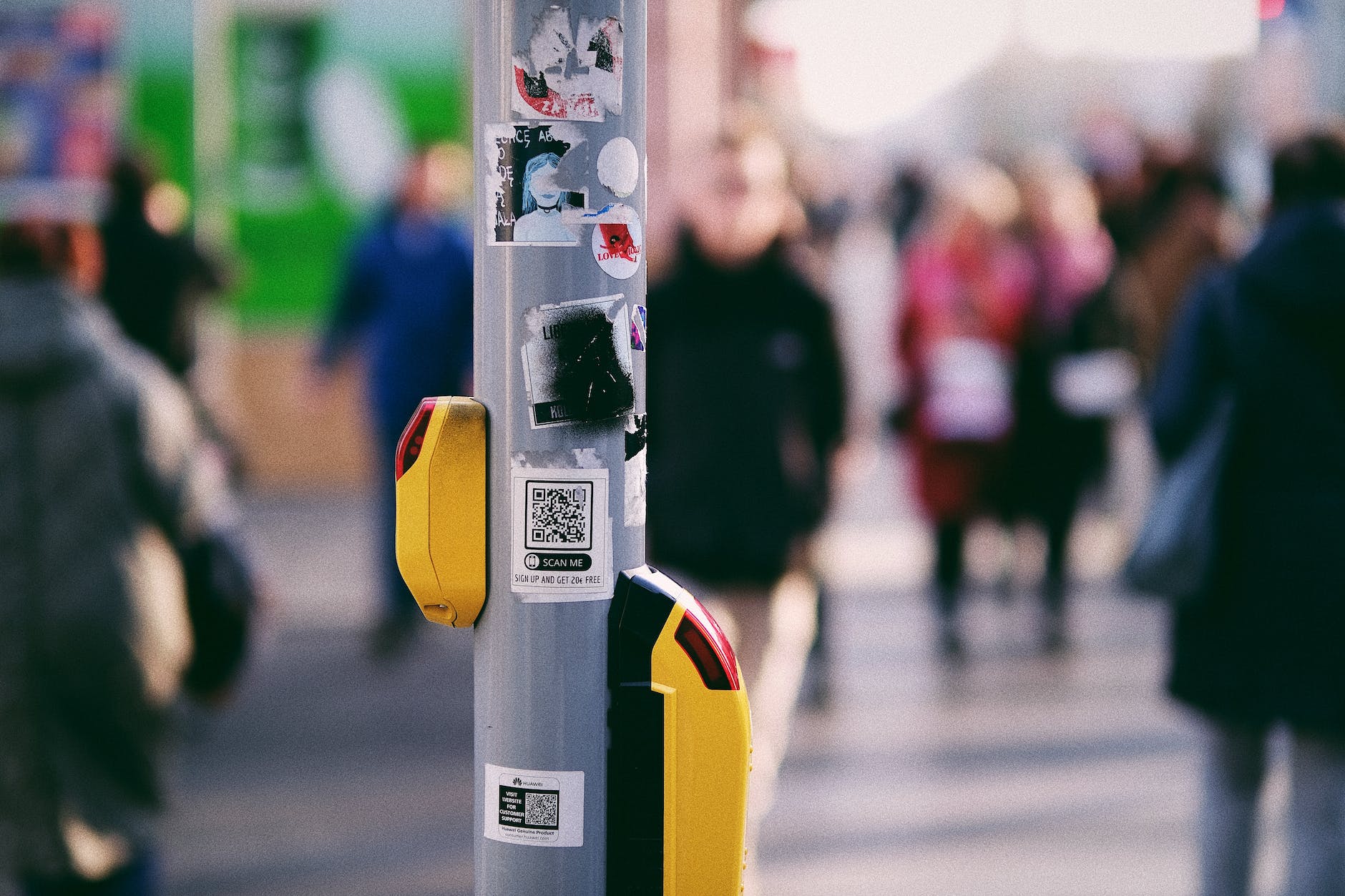 stickers on a metal pole