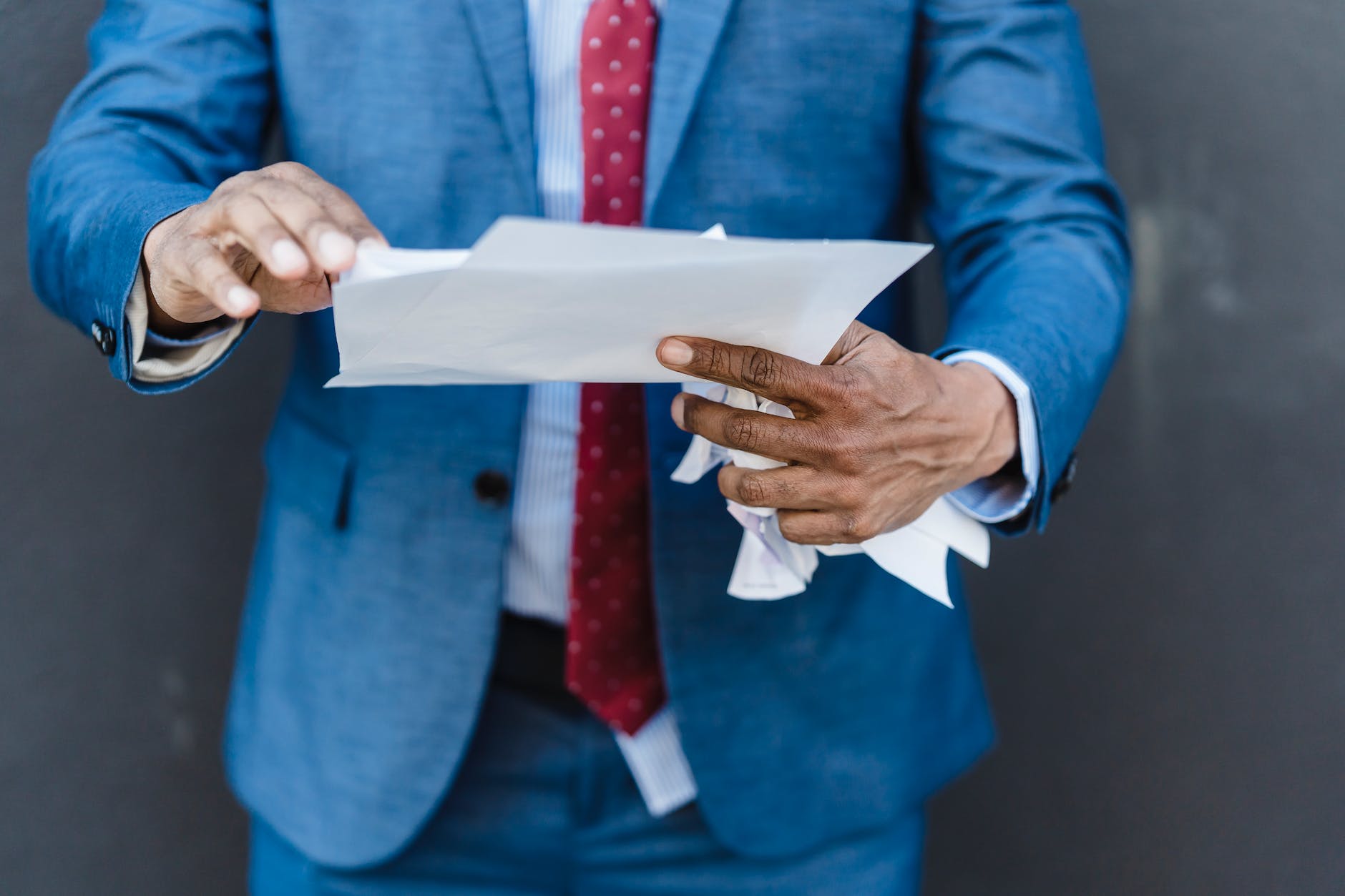 faceless entrepreneur with documents on street